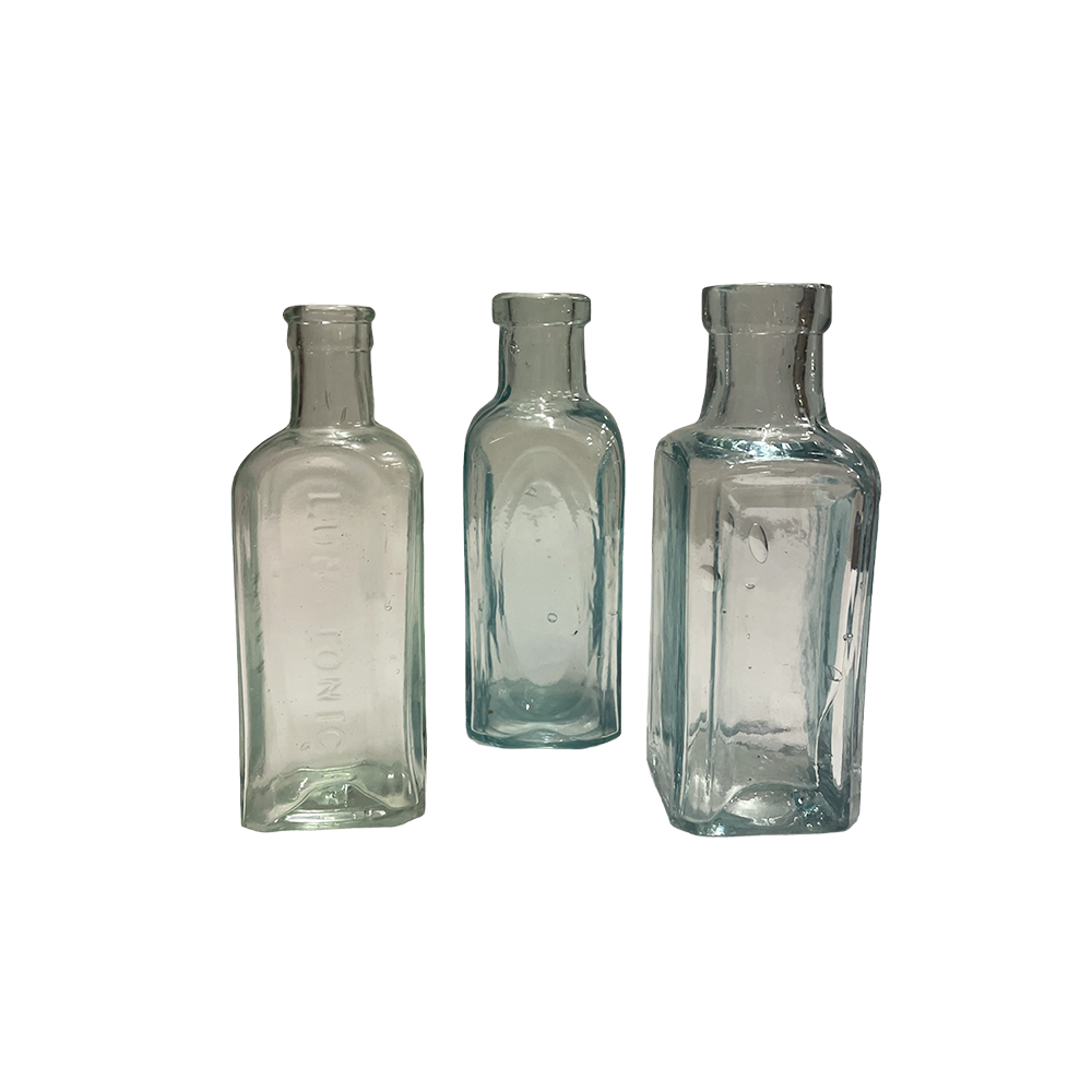 The Kira Medium Vintage Glass Bottle Array Wedding and Event Hire