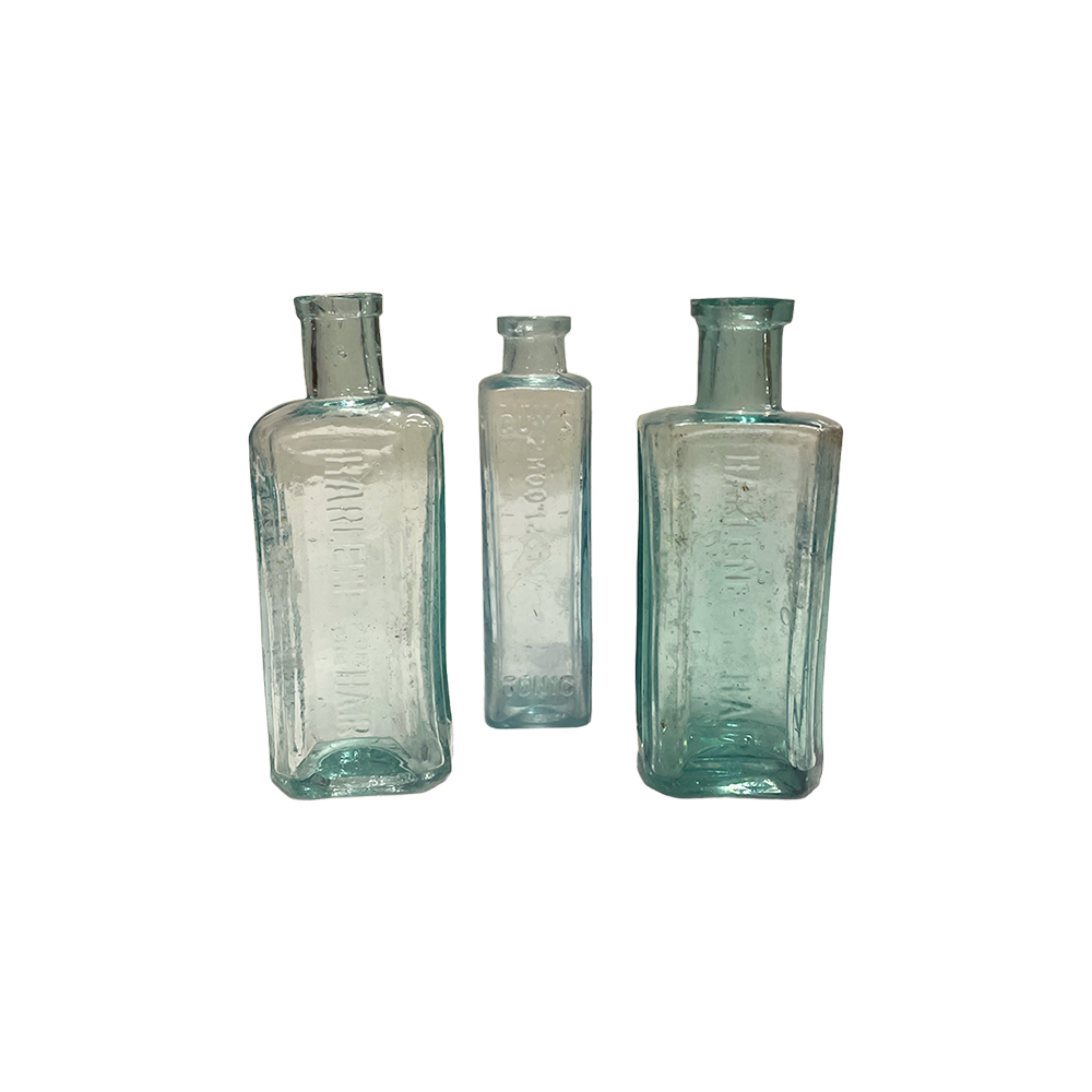 The Kira Small Vintage Glass Bottle Array Wedding and Event Hire